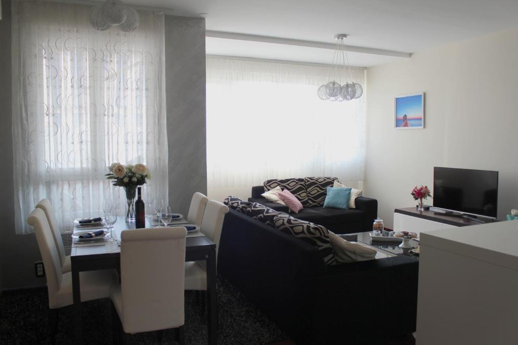 a living room with a couch and a table at Beautiful and luxury apartment in Split centre in Split