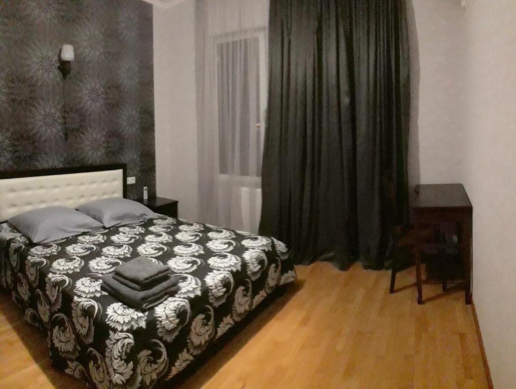 Postel nebo postele na pokoji v ubytování GNT+