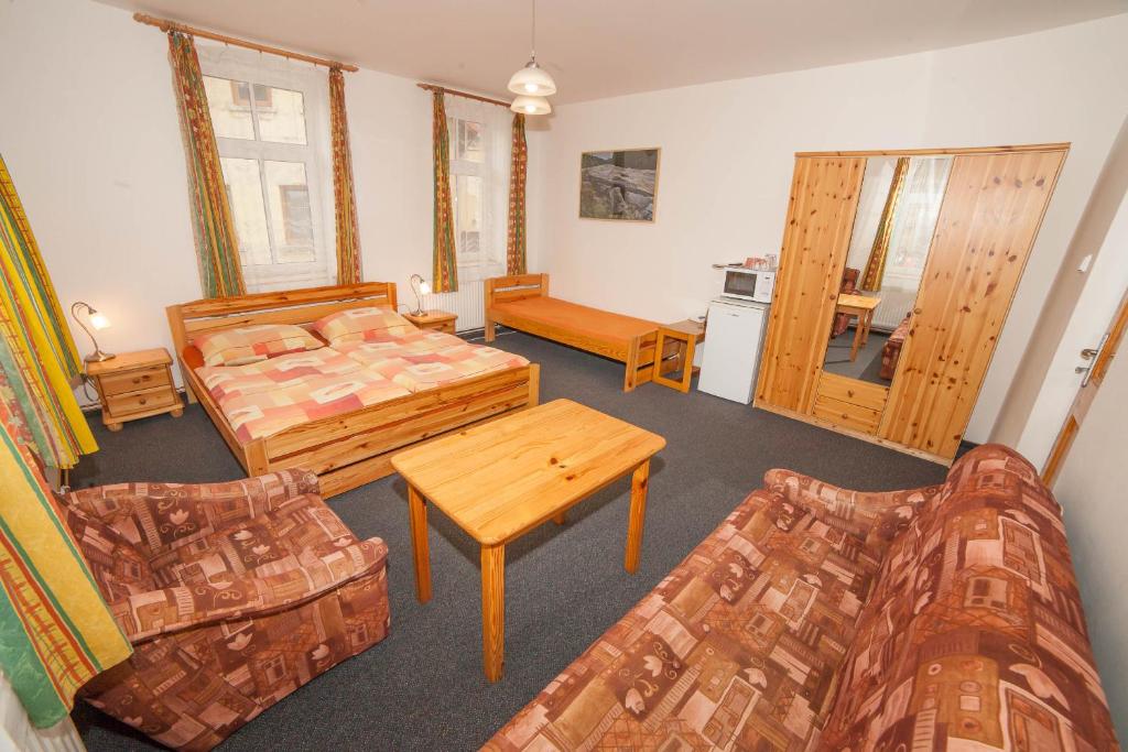 Postel nebo postele na pokoji v ubytování Penzion Na Rozcestí