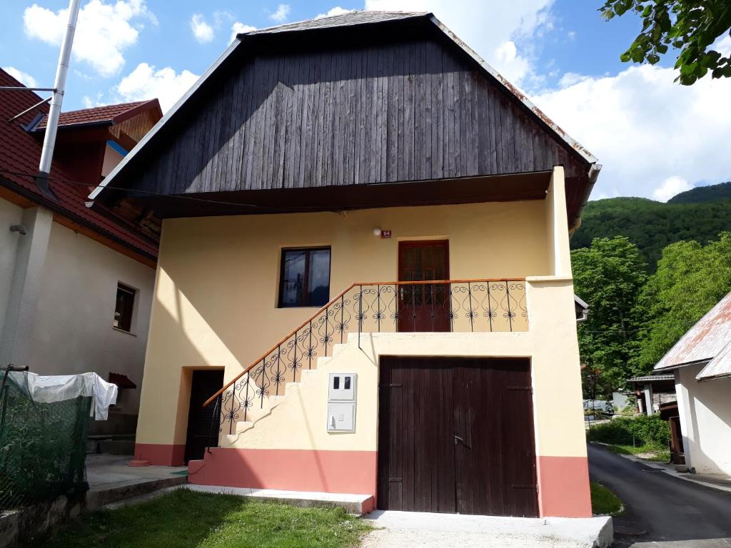 a house with a black roof at Peaceful old house in Bovec