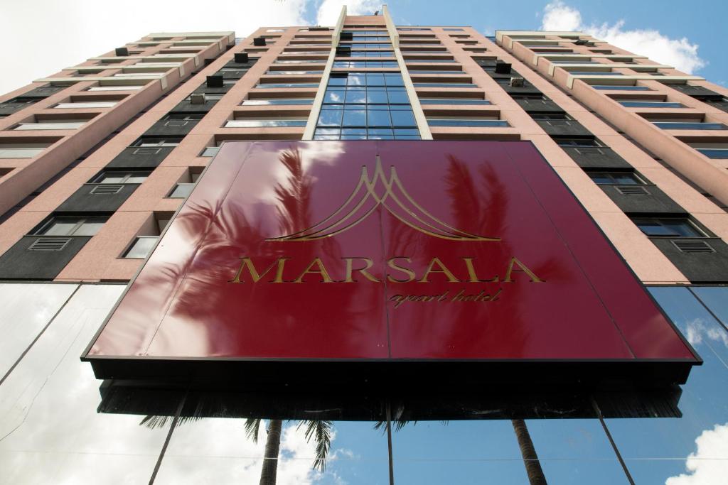 a sign on the side of a marsala building at Marsala Apart Hotel in Mogi das Cruzes