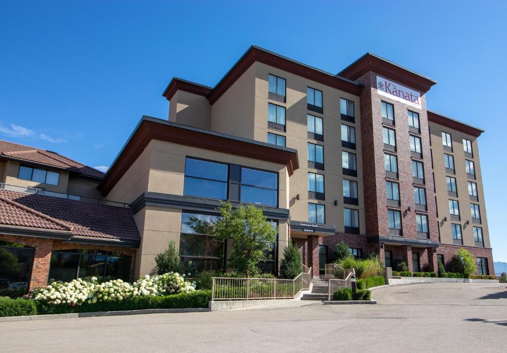 a large building with a lot of windows at Hotel Kelowna & Conference Centre in Kelowna