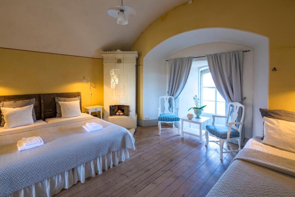 Postel nebo postele na pokoji v ubytování Kastellet Bed & Breakfast