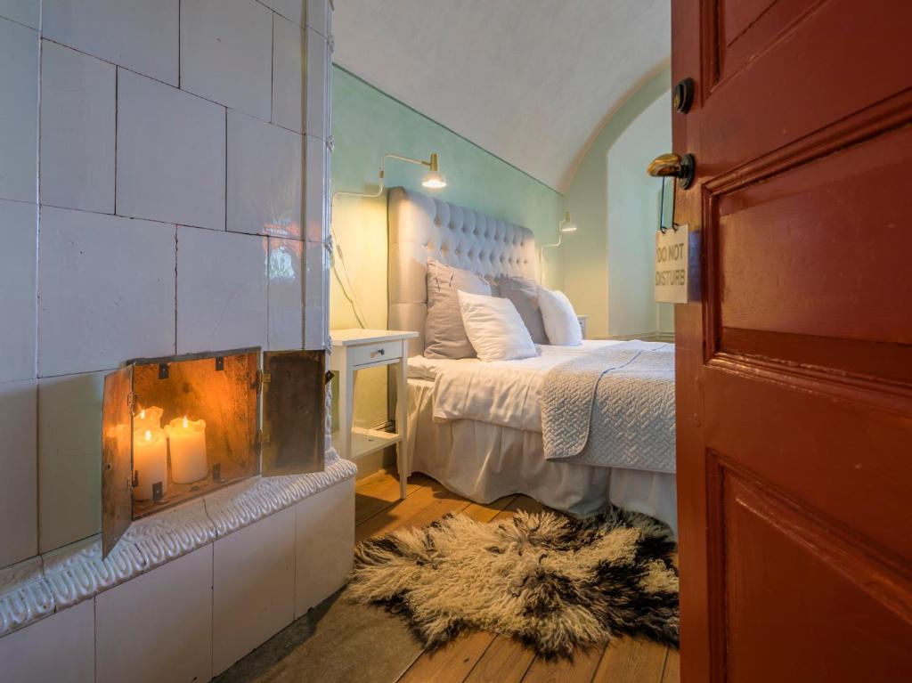 Postel nebo postele na pokoji v ubytování Kastellet Bed & Breakfast
