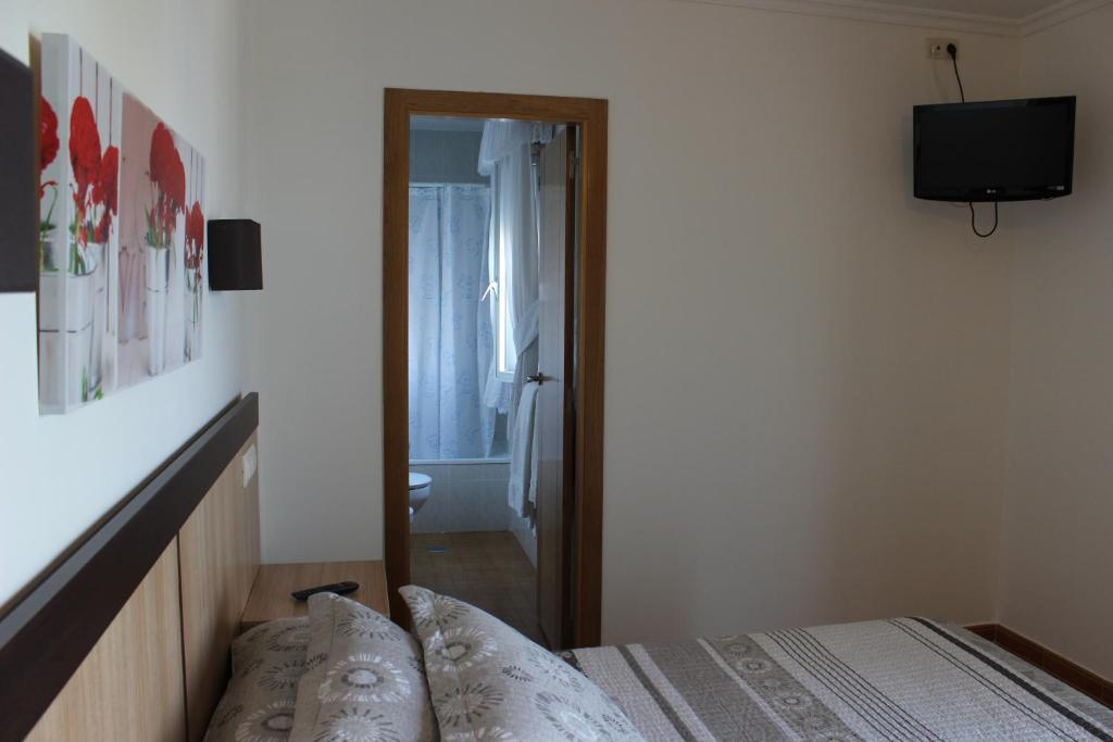 Postel nebo postele na pokoji v ubytování Hotel Estrella del Mar