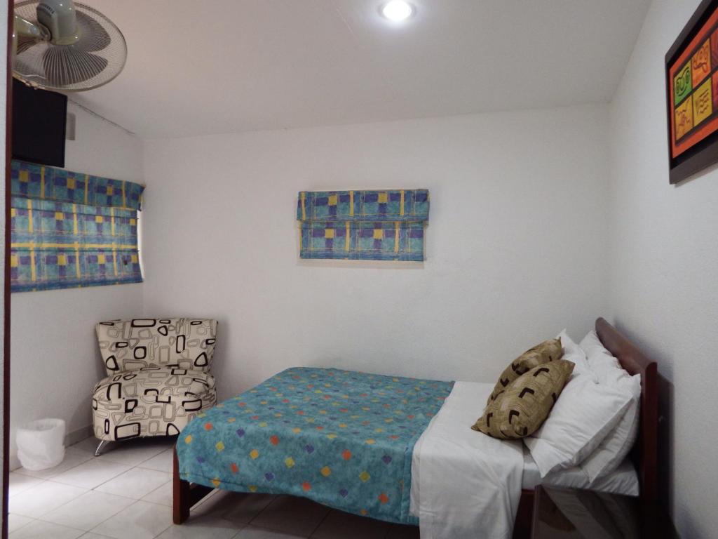 Postel nebo postele na pokoji v ubytování Hotel Campestre Villa Yudy