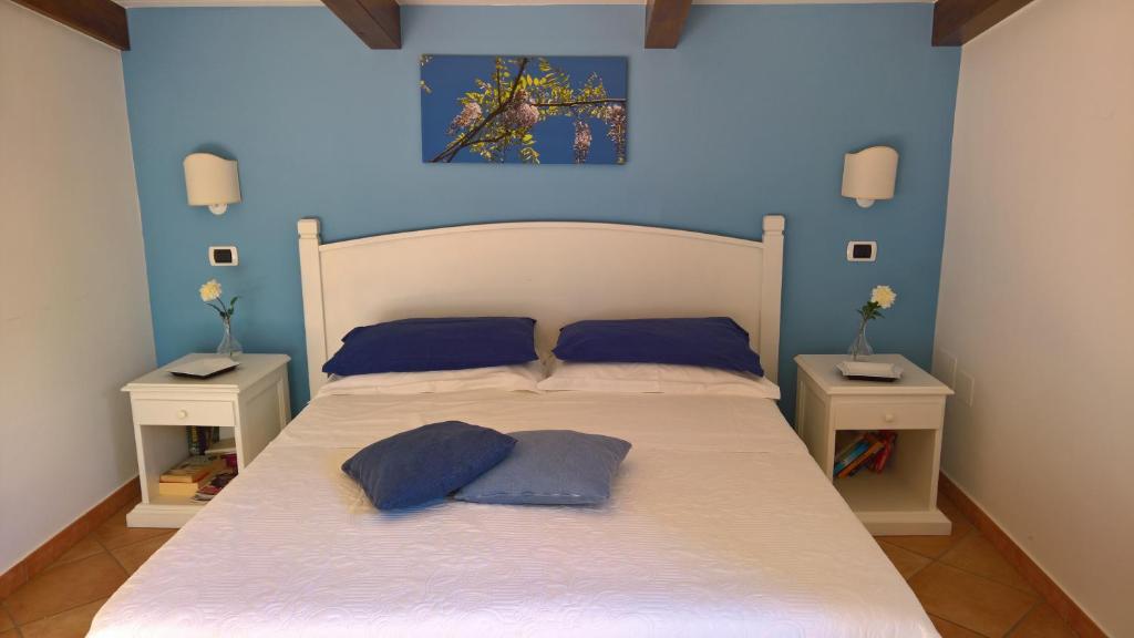 Postel nebo postele na pokoji v ubytování Villa Flavia