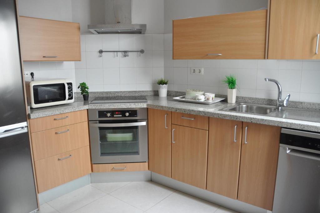 Kuchyňa alebo kuchynka v ubytovaní Apartment Canteras Beach Anadela