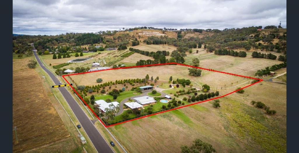 an aerial view of a large estate with a house at 505 CONROD STRAIGHT MOUNT PANORAMA in Bathurst