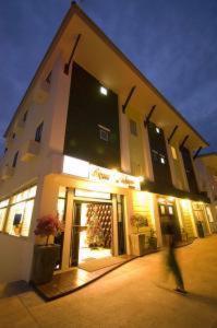 a person walking in front of a building at Royal Nakara Ao Nang in Ao Nang Beach