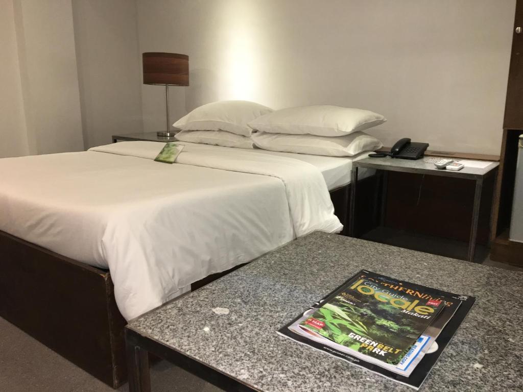 Postel nebo postele na pokoji v ubytování Hotel Durban