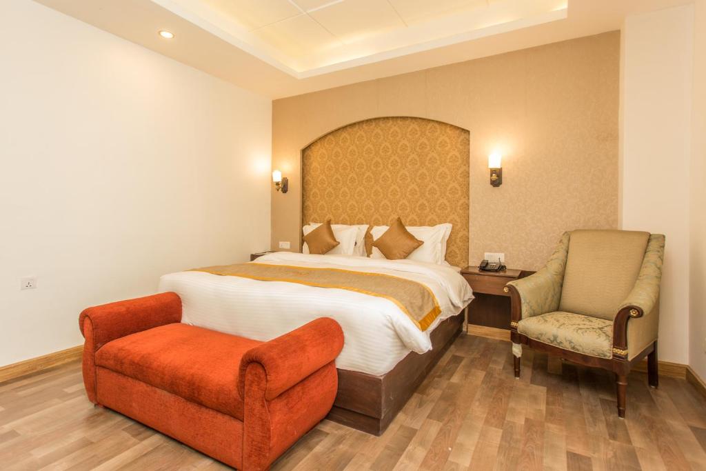 Rúm í herbergi á Hotel Ichchha