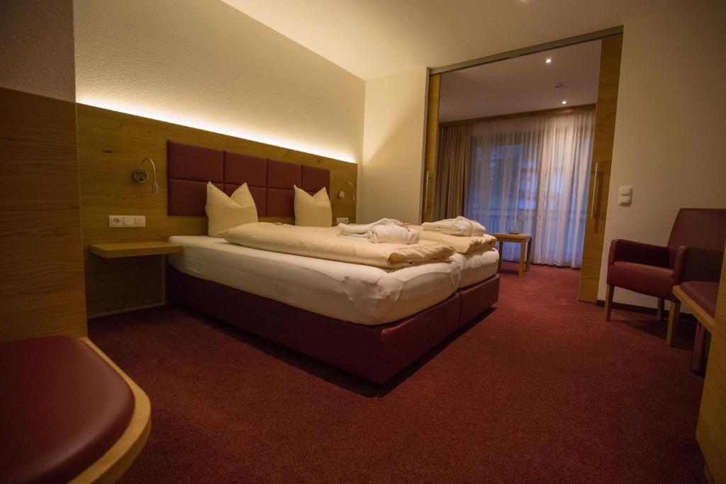 Postel nebo postele na pokoji v ubytování Natur-Genuss-Hotel Sonnasita