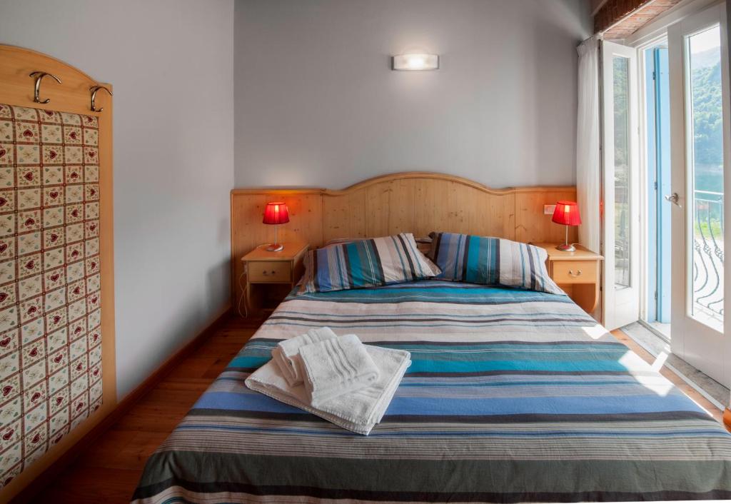 Postel nebo postele na pokoji v ubytování Albergo Parigi