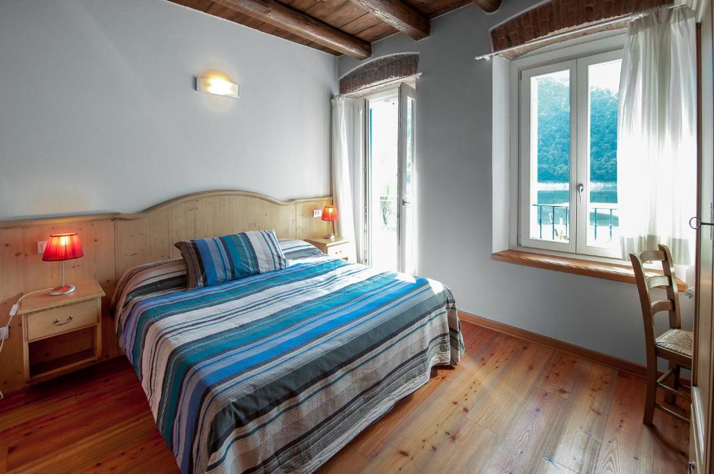 Postel nebo postele na pokoji v ubytování Albergo Parigi