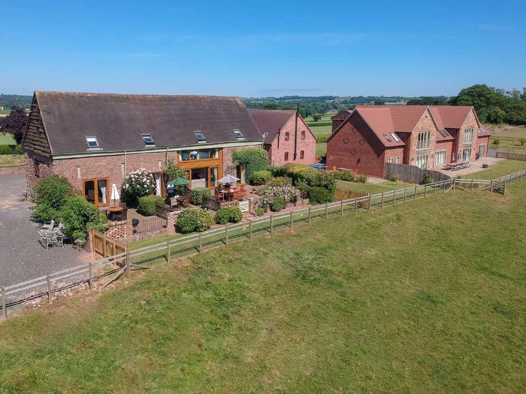 an aerial view of a house with a yard at The Dinney Holiday Cottages in Bridgnorth