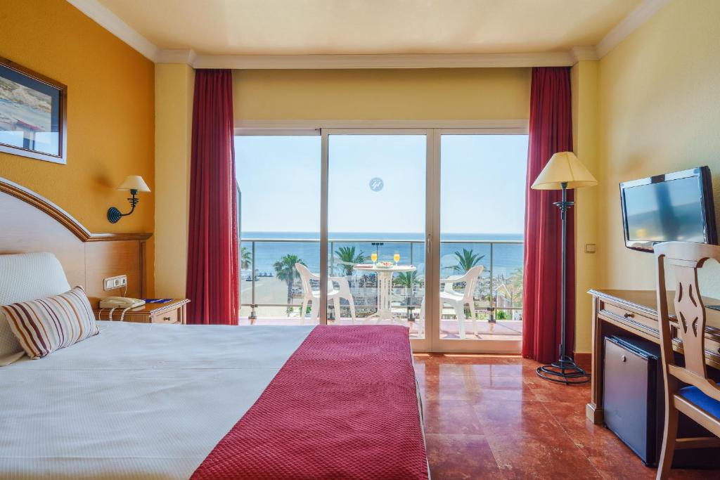 Postel nebo postele na pokoji v ubytování Hotel Isabel
