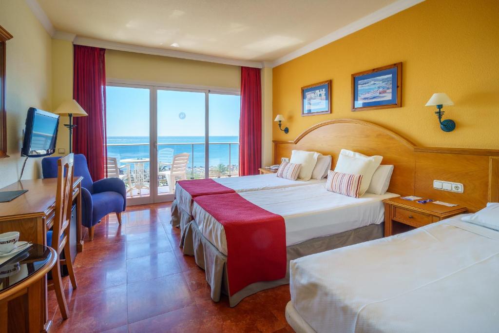 Postel nebo postele na pokoji v ubytování Hotel Isabel