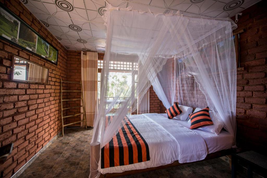 Postel nebo postele na pokoji v ubytování Apurvi Homestay