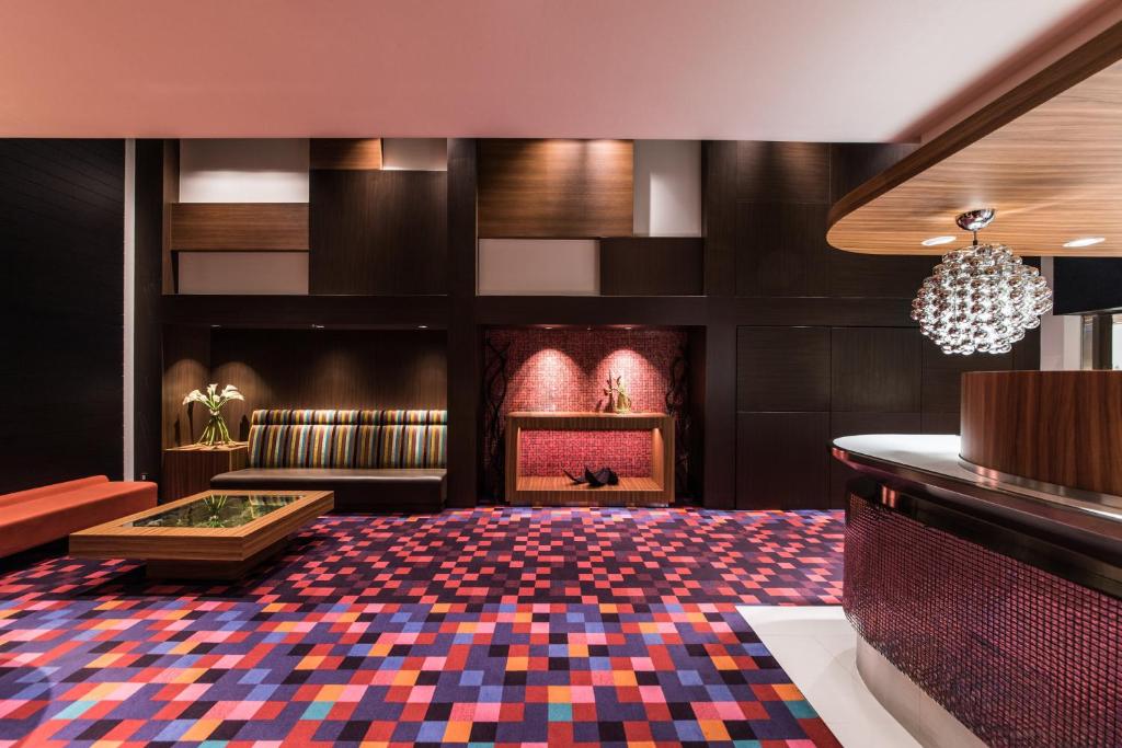 a lobby of a hotel with a colorful carpet at the b akasaka in Tokyo