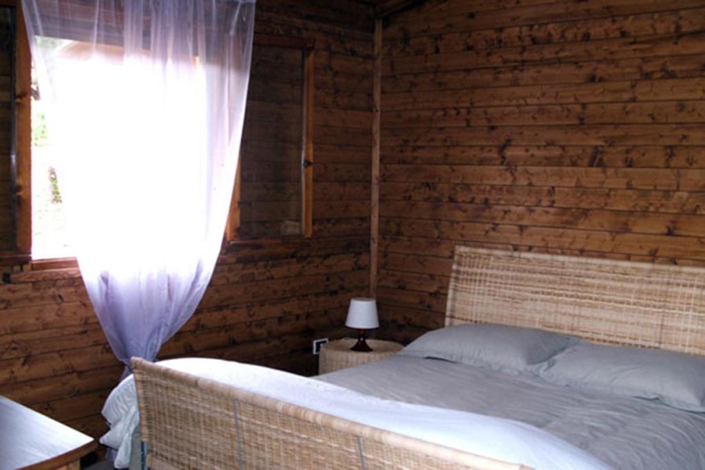Postel nebo postele na pokoji v ubytování I Giardini Di Margius