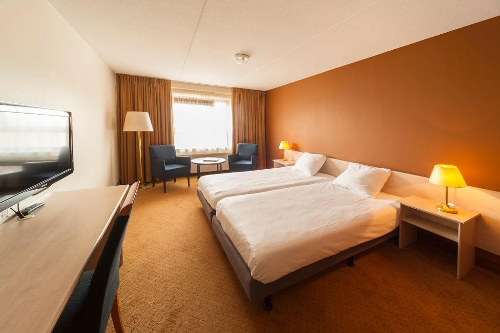 TV a/nebo společenská místnost v ubytování Hotel ReeHorst
