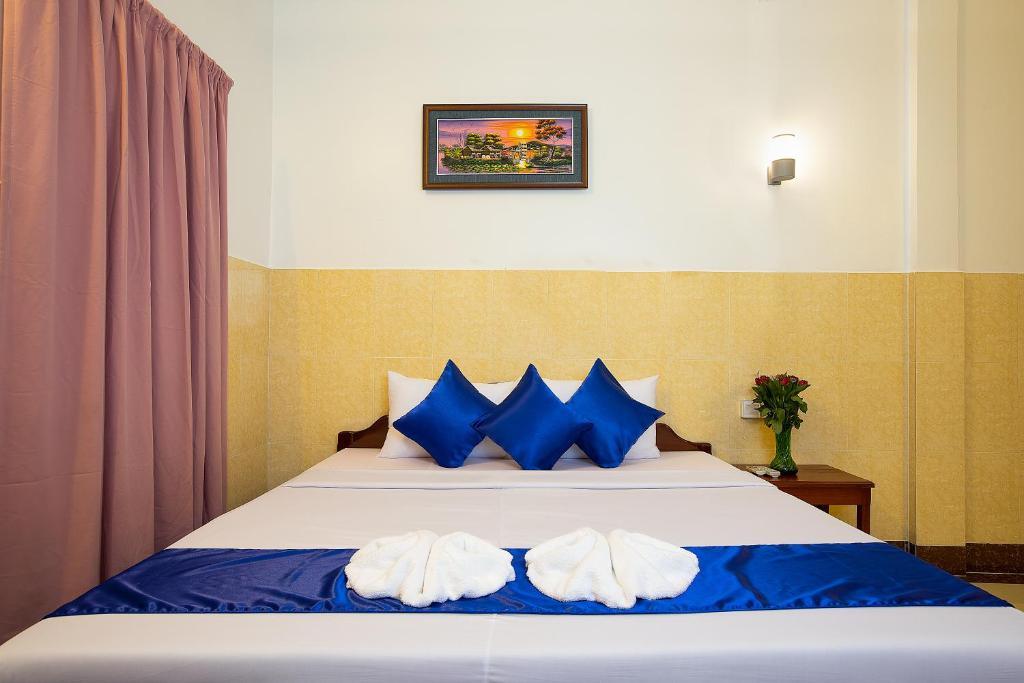 Ένα ή περισσότερα κρεβάτια σε δωμάτιο στο Botoum Hostel