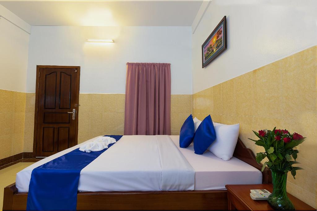 Ένα ή περισσότερα κρεβάτια σε δωμάτιο στο Botoum Hostel