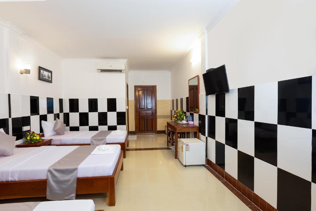 Ένα ή περισσότερα κρεβάτια σε δωμάτιο στο Botoum Hostel