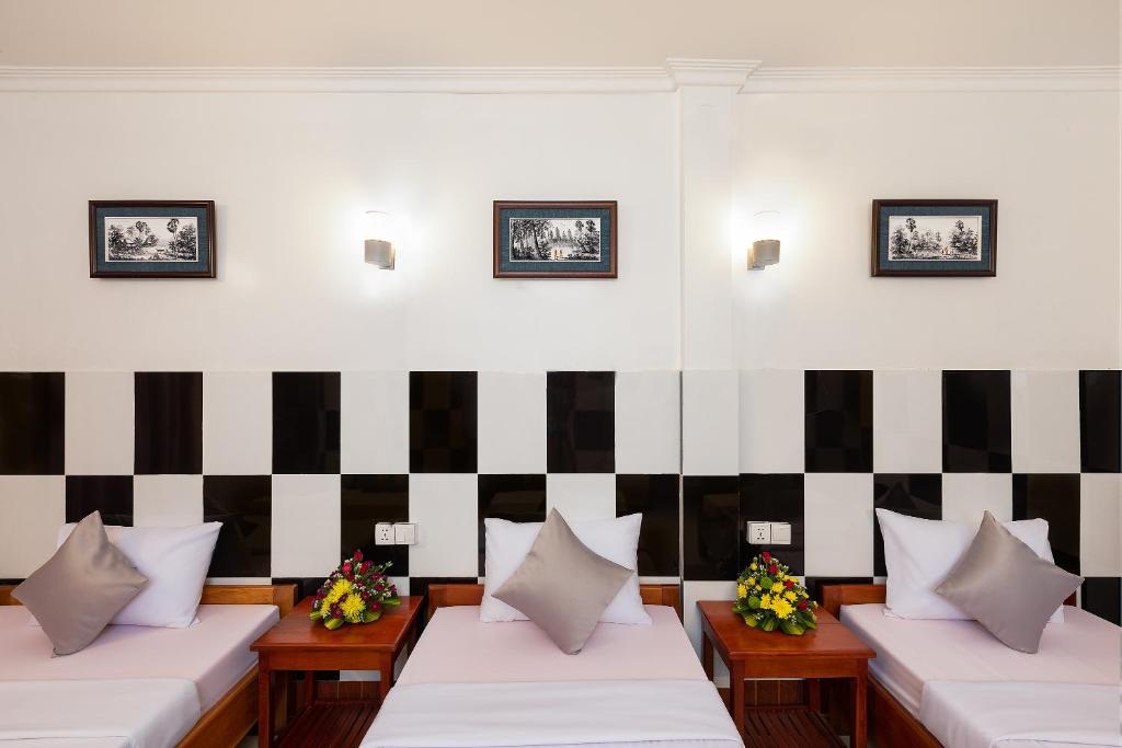 Ένα ή περισσότερα κρεβάτια σε δωμάτιο στο Botoum Hostel