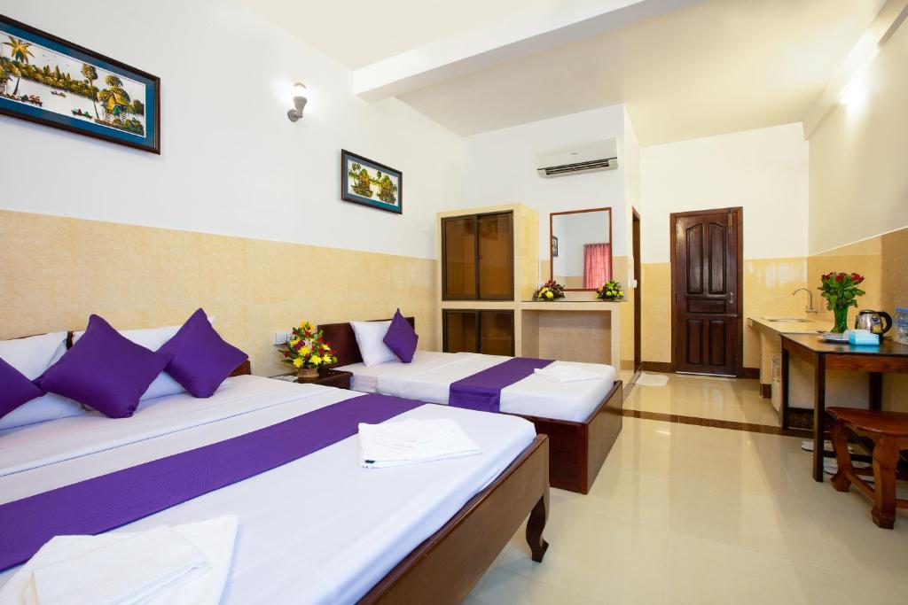 Ένα ή περισσότερα κρεβάτια σε δωμάτιο στο Botoum Hostel