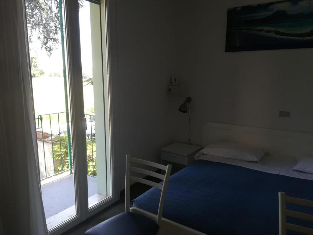 Postel nebo postele na pokoji v ubytování Hotel Tuscolano