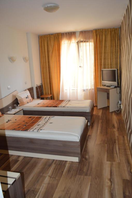 Postel nebo postele na pokoji v ubytování Eos Hotel