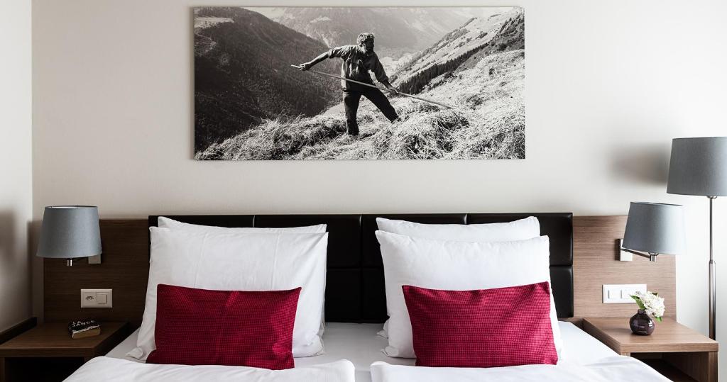 Postel nebo postele na pokoji v ubytování AMERON Luzern Hotel Flora