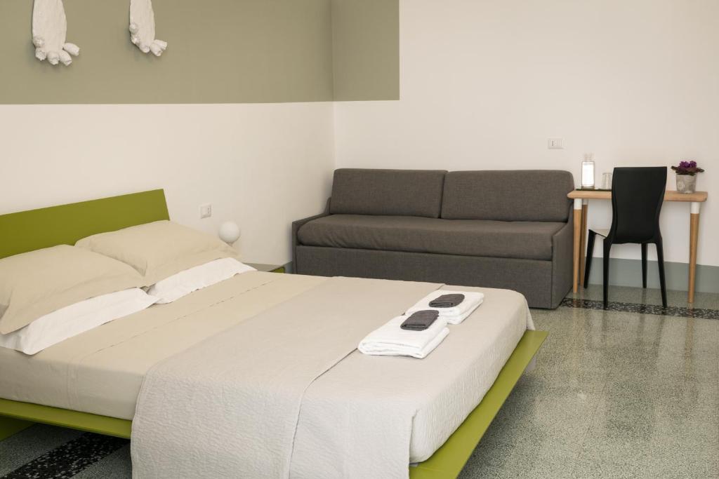Postel nebo postele na pokoji v ubytování B&B Le Giravolte
