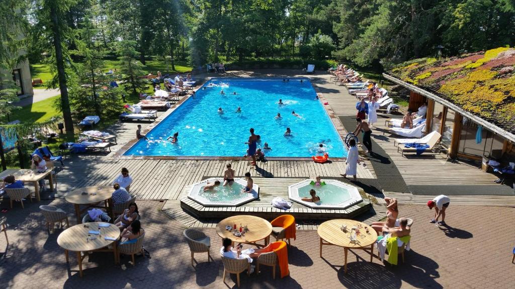 an overhead view of a swimming pool with people in it at Skandinavia Country Club and SPA in Sestroretsk