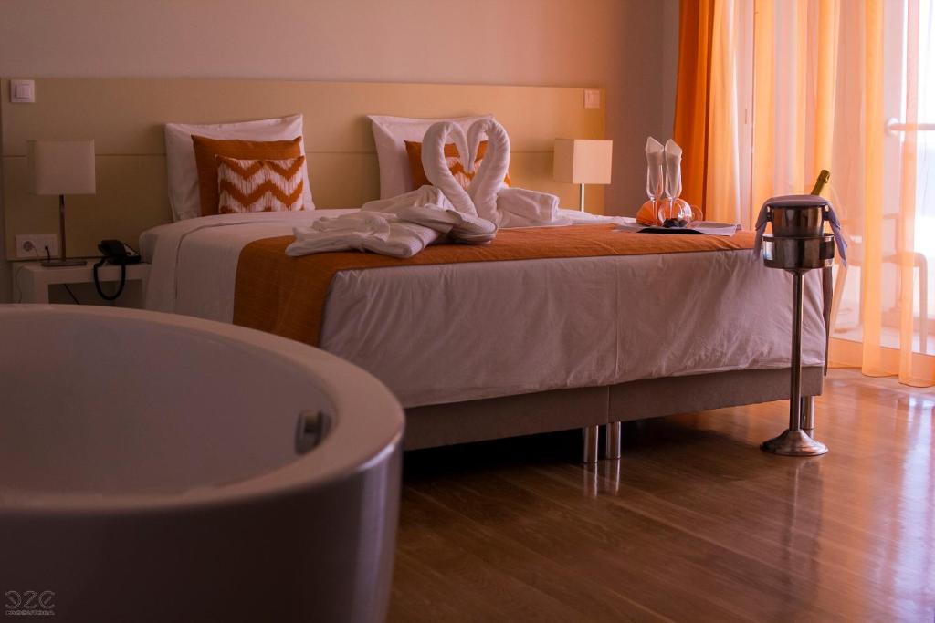 Postel nebo postele na pokoji v ubytování Tiduca Hotel