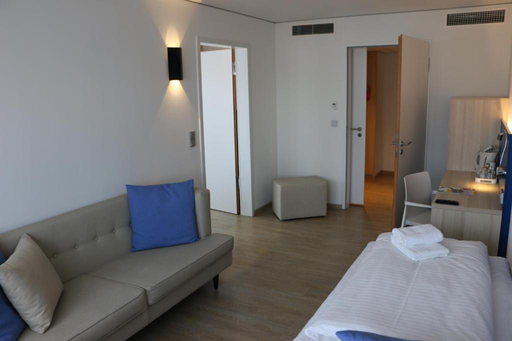 Postel nebo postele na pokoji v ubytování Aparthotel Paderborn