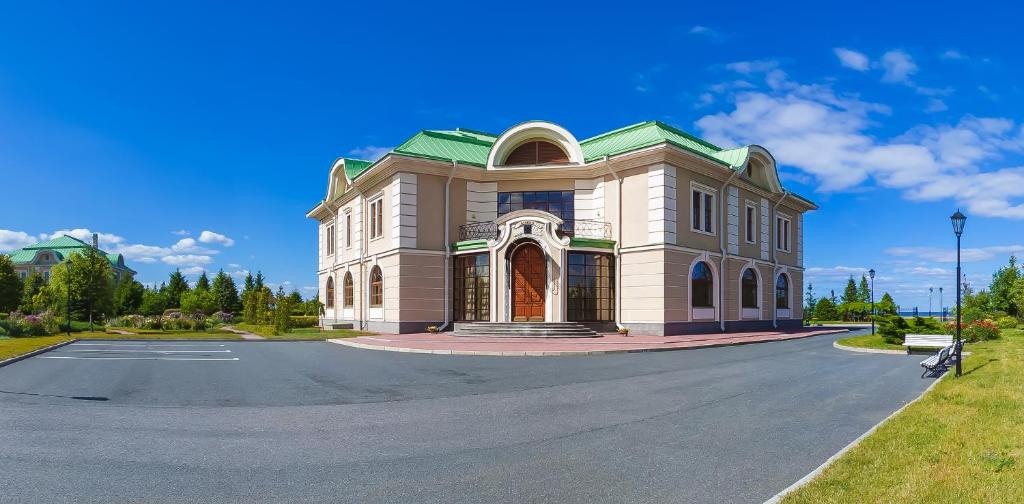 a large building on a street with a road at Baltic Star Villas in Petergof