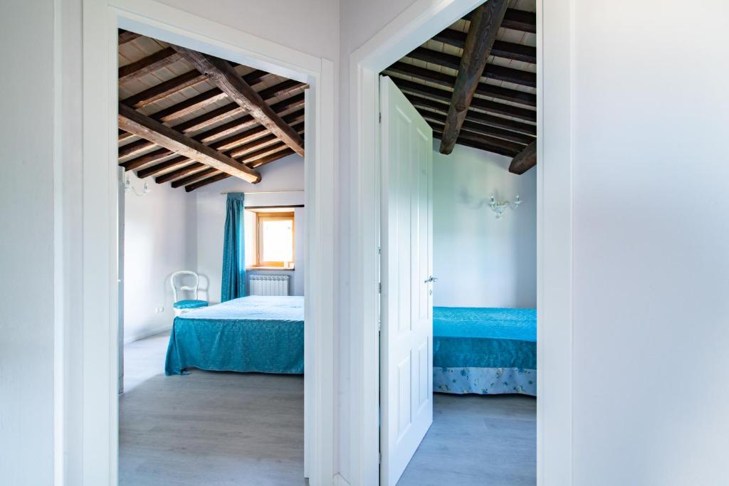 Postel nebo postele na pokoji v ubytování Il Castello Di Perchia