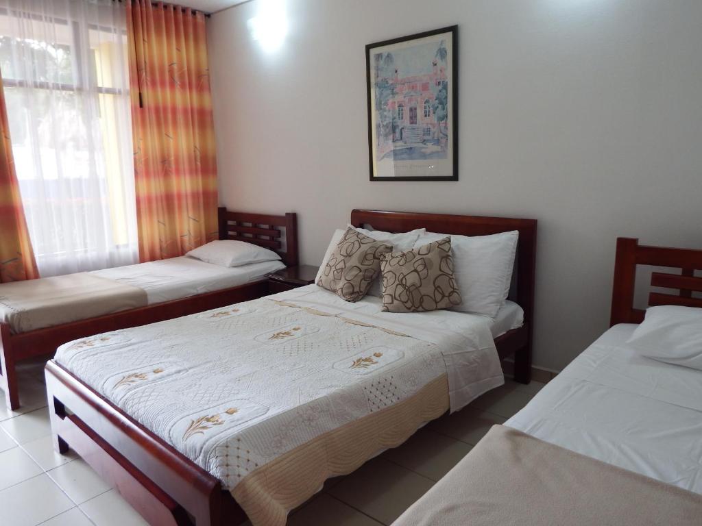 Postel nebo postele na pokoji v ubytování Hotel Campestre Villa Yudy