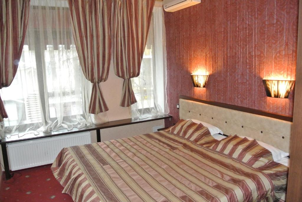 Postel nebo postele na pokoji v ubytování Annabelle отель