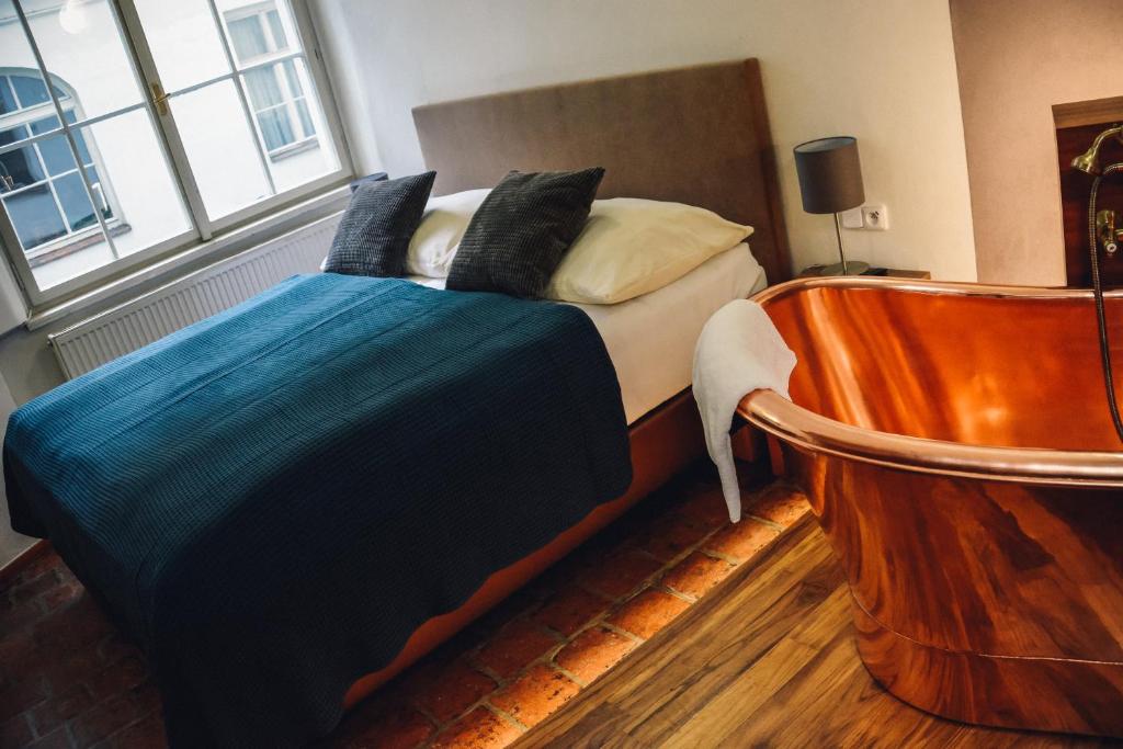 Postel nebo postele na pokoji v ubytování U Medvidku-Brewery Hotel