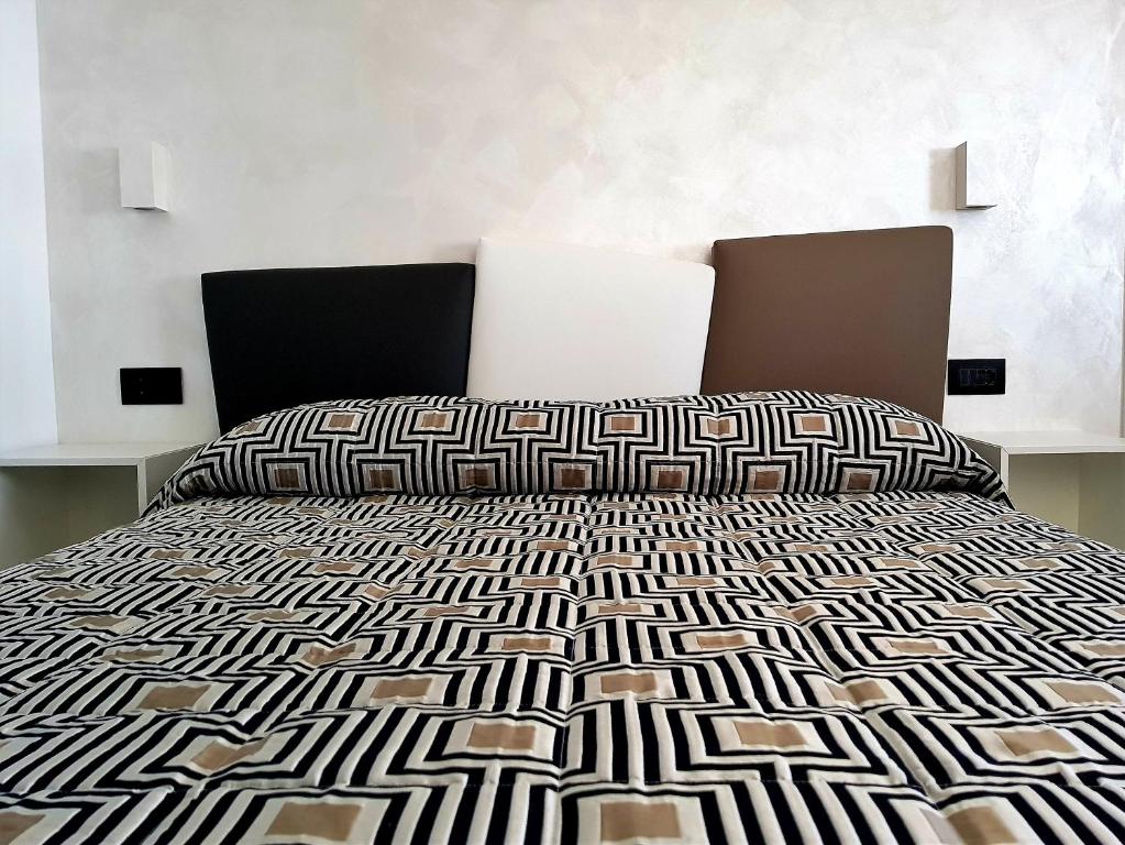 Łóżko lub łóżka w pokoju w obiekcie B&B Porta Marina