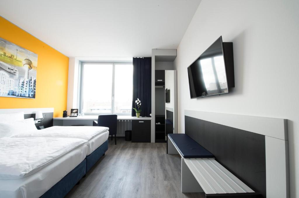 Carathotel Düsseldorf City - Resim 12