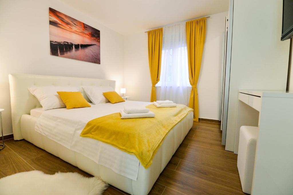 Posteľ alebo postele v izbe v ubytovaní Sunset Gold