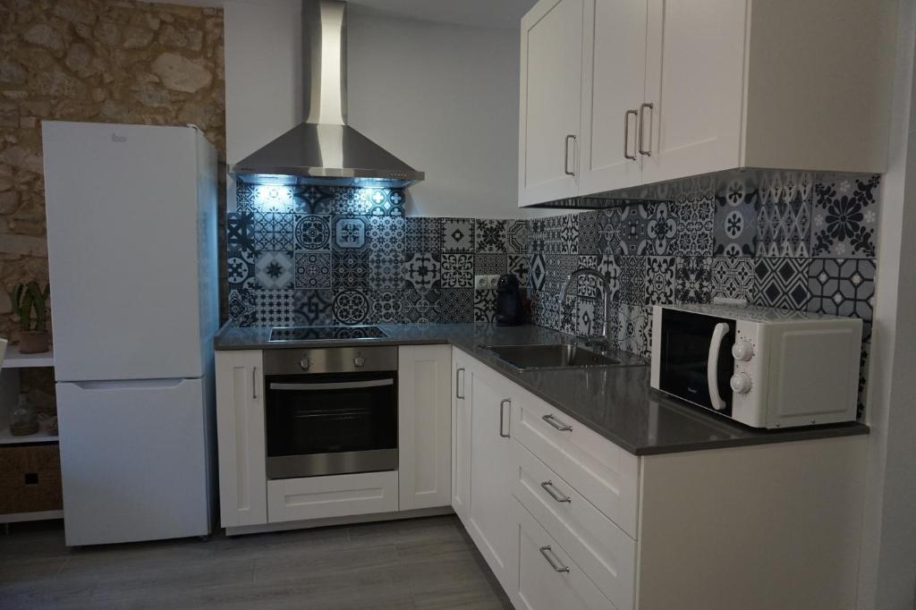 Kuchyň nebo kuchyňský kout v ubytování BOREAS Apartaments