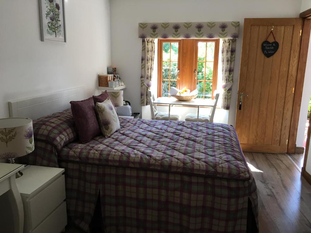 Postel nebo postele na pokoji v ubytování Alderdale B&B