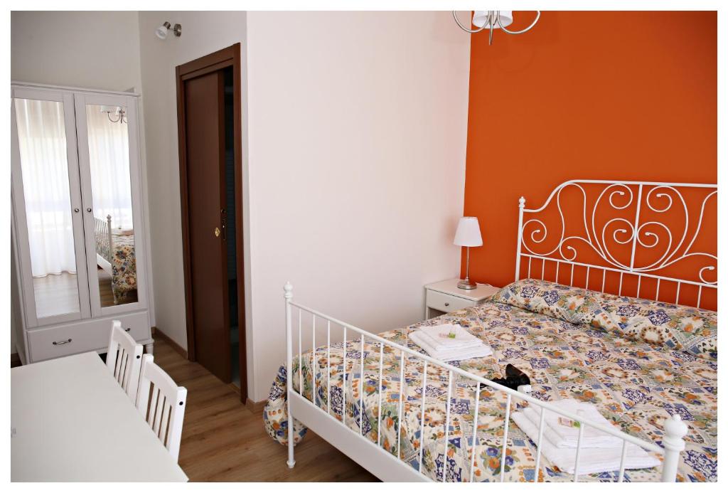 Posteľ alebo postele v izbe v ubytovaní Tosca B&B