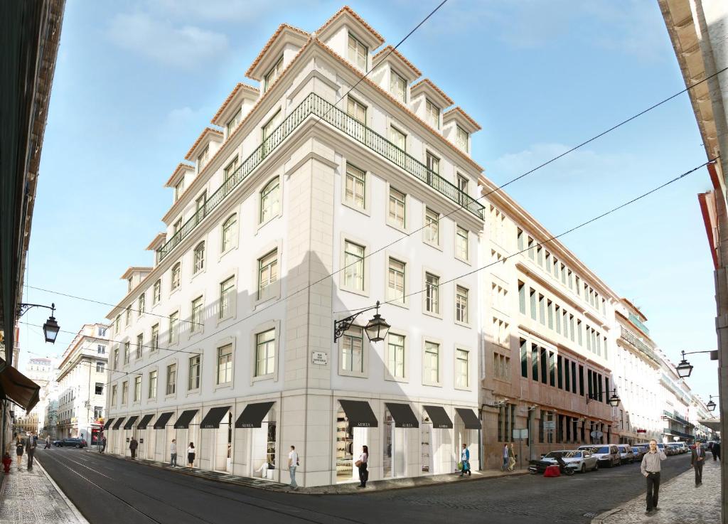 a white building on the corner of a street at Aurea Once Upon House in Lisbon